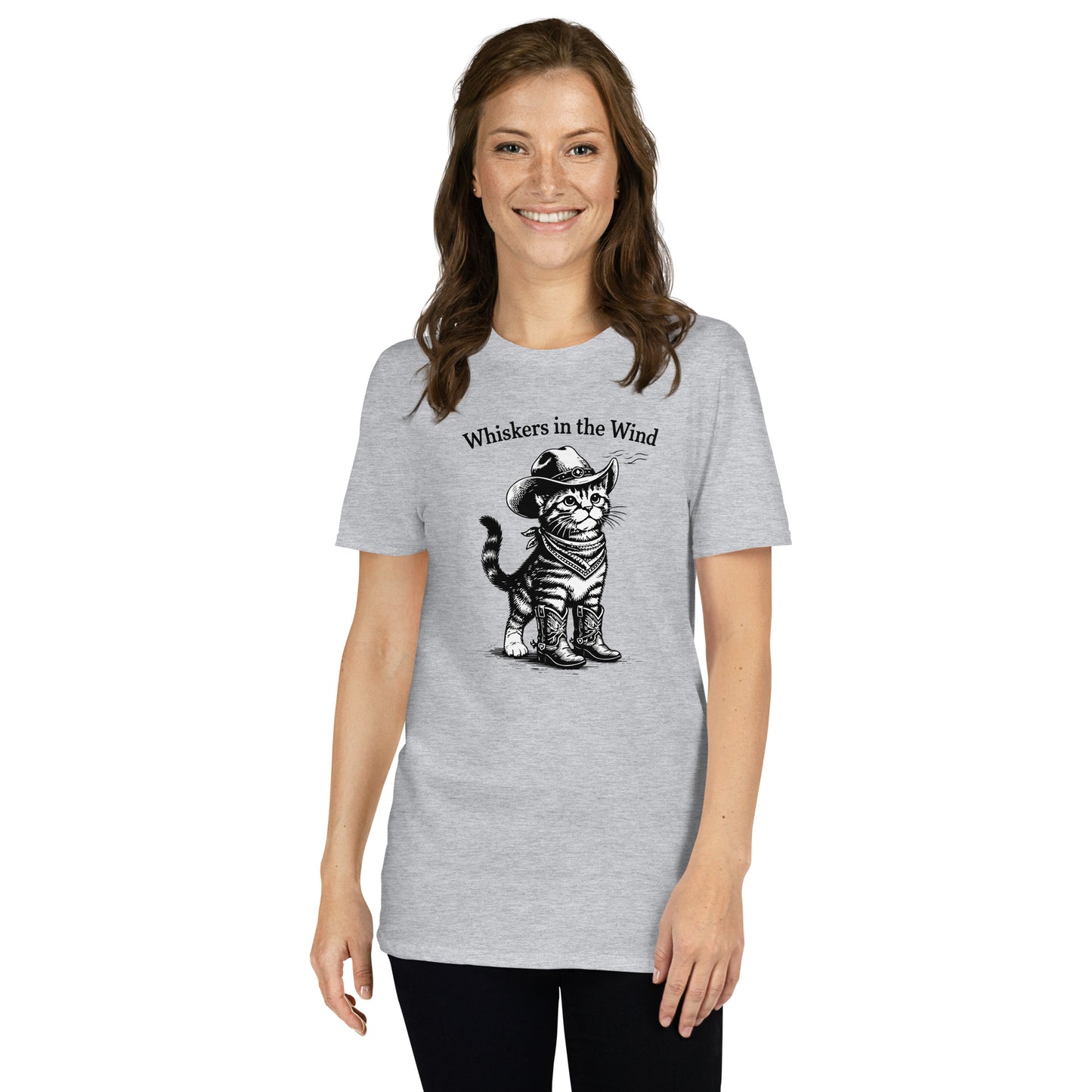 Woman wearing a gray t-shirt with a graphic of a cat and text 'Whiskers in the Wind' on a white background