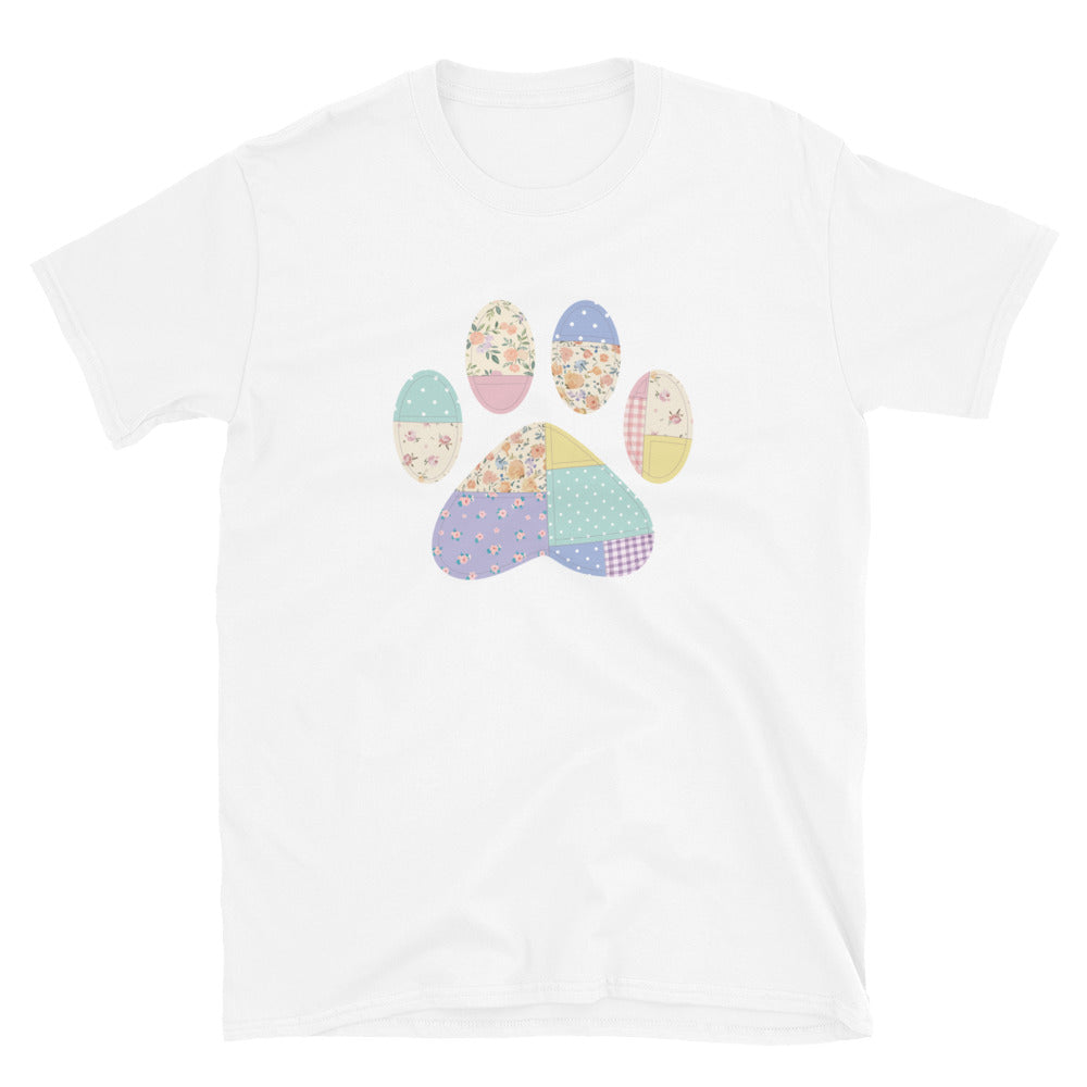 White t-shirt with a colorful paw print design on a white background
