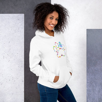 Woman wearing a white hoodie with colorful text and graphics against a gray and white background