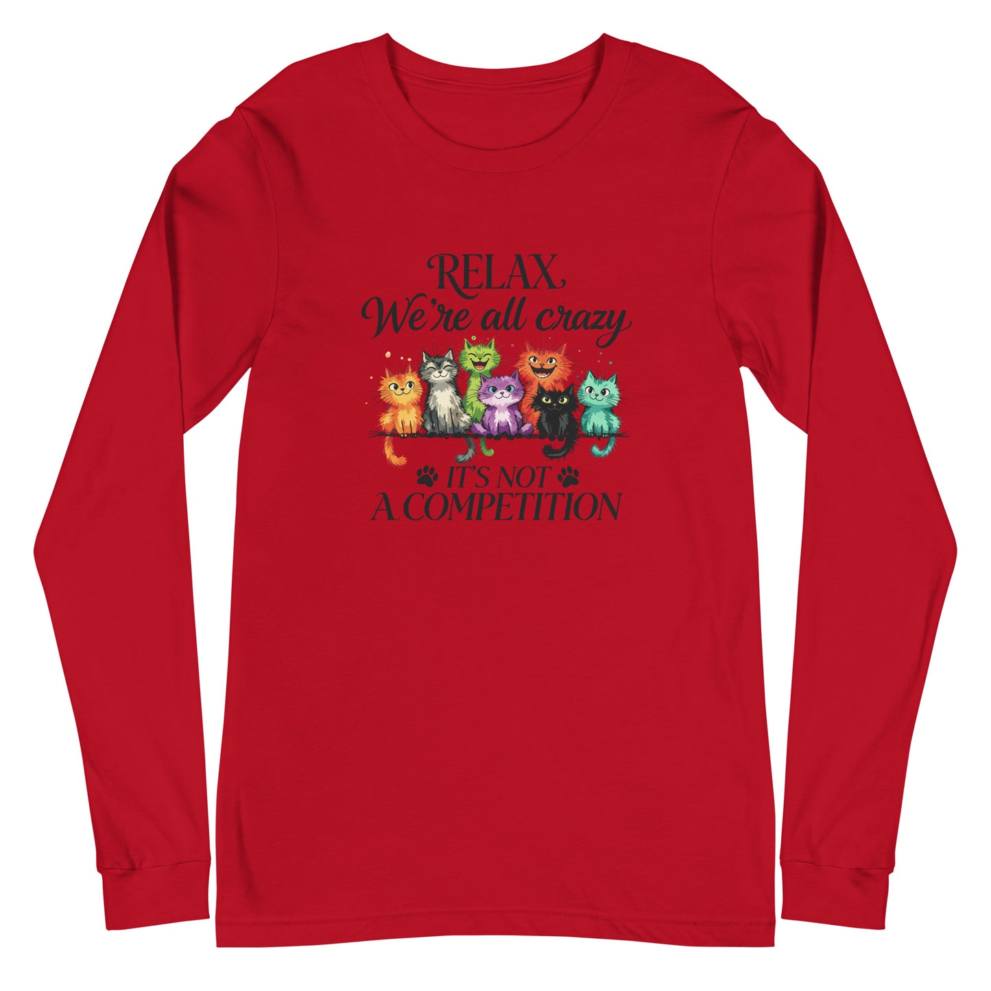 A red long-sleeve crewneck t-shirt with a graphic print of seven colorful cartoon cats sitting on a scale, with the text 'RELAX. We're all crazy IT'S NOT A COMPETITION' in dark lettering.