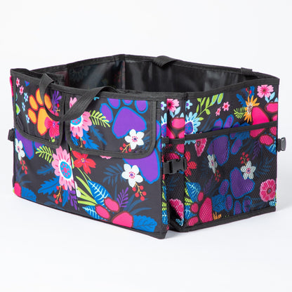 Colorful paw print patterned car trunk organizer with pockets on the front, and a mesh pocket on the side.