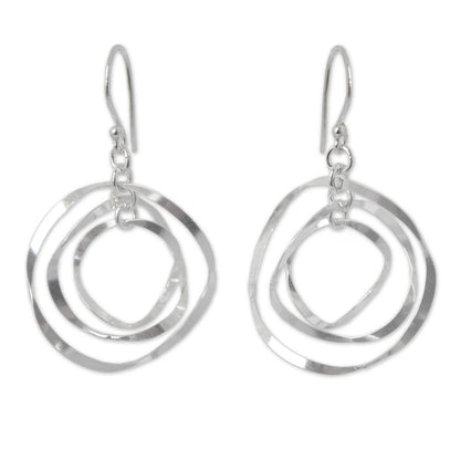 Twirling Silver Circular Dangle Earrings