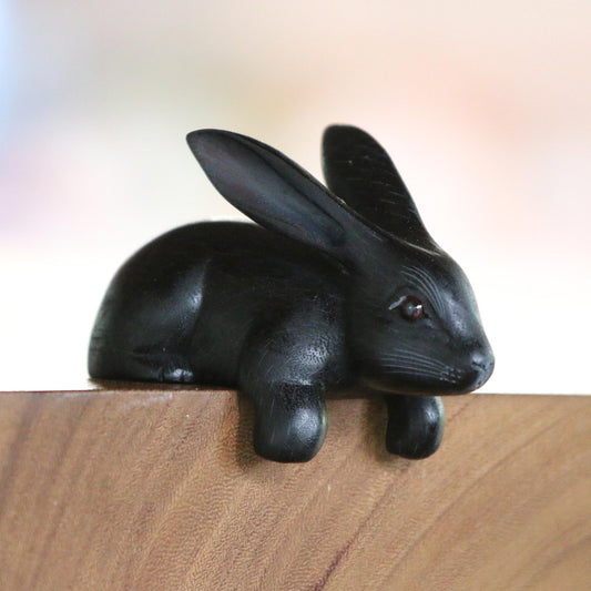 Curious Rabbit in Black Handcrafted Suar Wood Rabbit Sculpture in Black from Bali