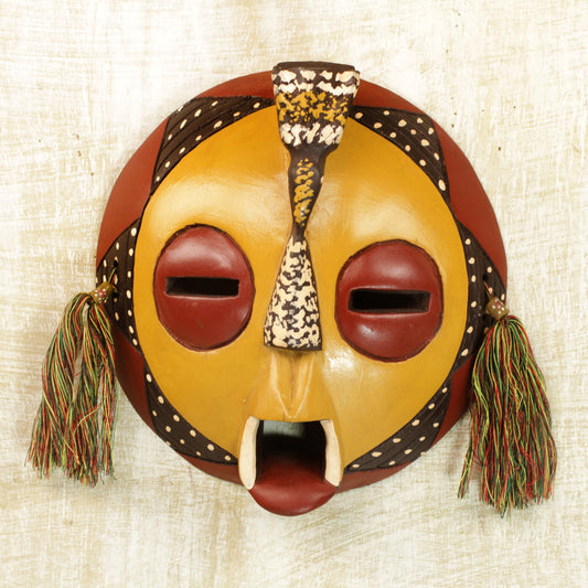 Calm One Handcrafted Yellow Sese Wood Wall Mask from Ghana