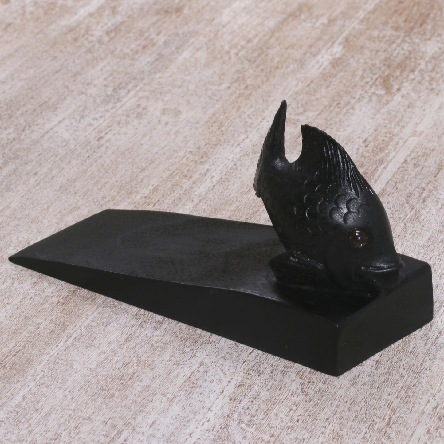 Helpful Goldfish in Black Handcrafted Suar Wood Fish Doorstop in Black from Bali