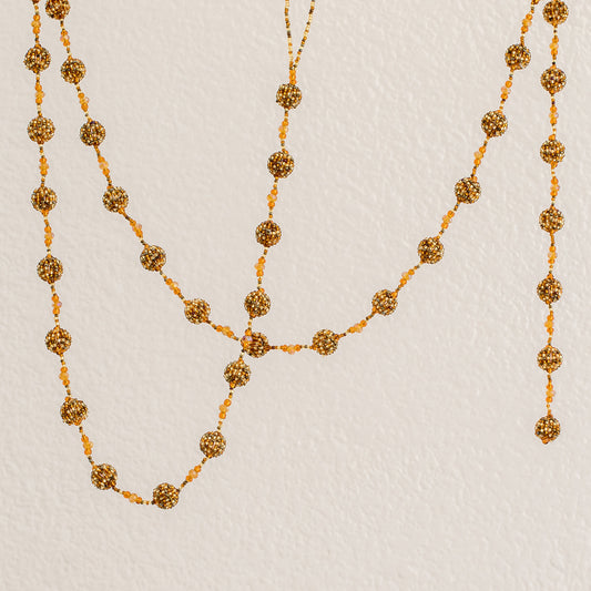 Golden Silhouettes Glass Beaded Garland in Orange from Guatemala