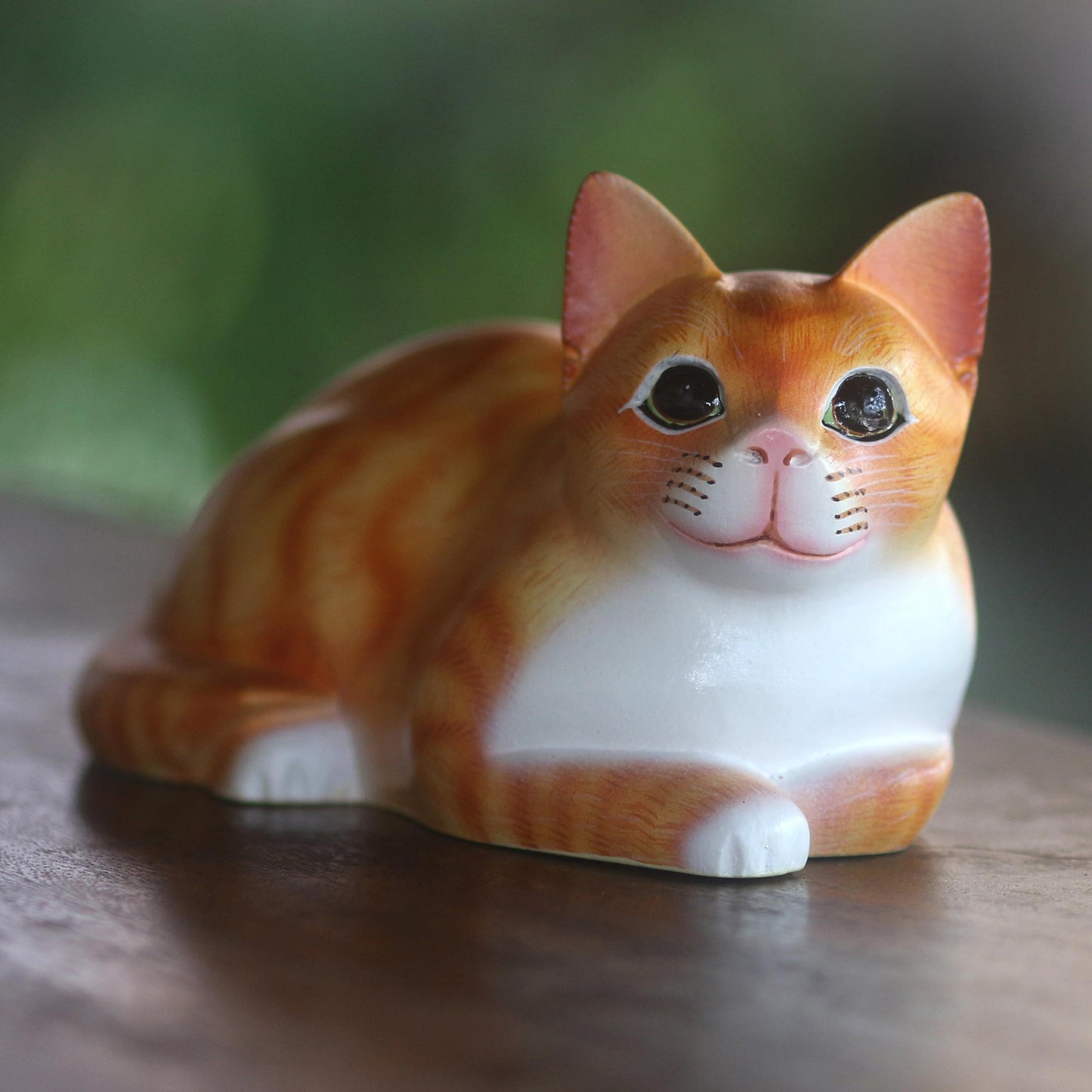 Lying Cat in Orange Signed Wood Sculpture of a Lying Cat in Orange from Bali