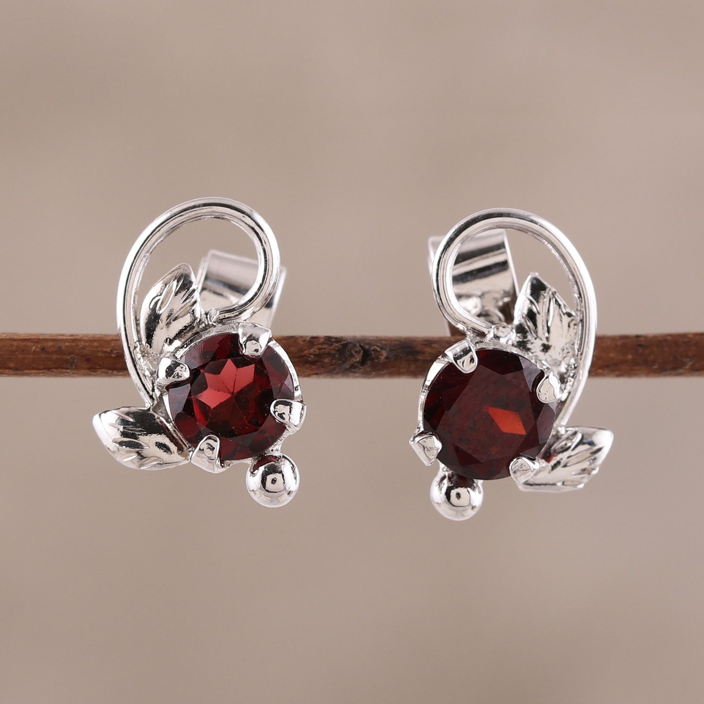 Blissful Radiance Leafy Rhodium Plated Garnet Stud Earrings from India